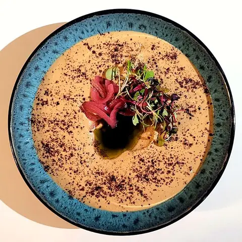 Hummus on a blue bowl