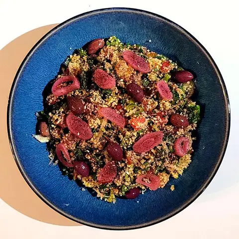 Tabbouleh on a blue bowl