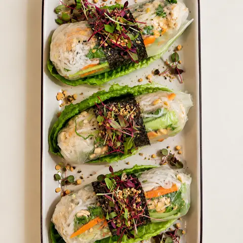 3 spring rolls on a plate